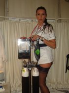 Nurse with big tits in lingerie showing her ass